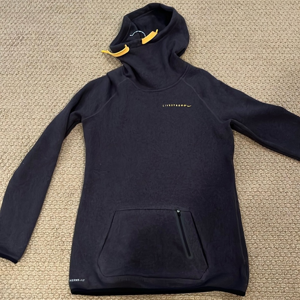 Men’s therma fit Nike Livestrong hooded sweatshirt. Runs narrow and long.